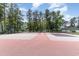Well-maintained tennis courts surrounded by tall trees, providing an excellent recreational amenity at 6734 Blue Heron Blvd. # 104, Myrtle Beach, SC 29588