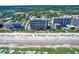Aerial view of beach condos along a white sandy beach with ocean views at 7100 N Ocean Blvd. # 317, Myrtle Beach, SC 29572