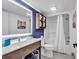 Bright bathroom featuring a vanity with modern fixtures and a shower with glass doors at 7100 N Ocean Blvd. # 317, Myrtle Beach, SC 29572