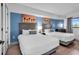 Bright bedroom with two beds, modern decor, and a window for natural light at 7100 N Ocean Blvd. # 317, Myrtle Beach, SC 29572