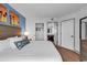 Bedroom with closet and bathroom featuring bright interior decor and white bedding at 7100 N Ocean Blvd. # 317, Myrtle Beach, SC 29572