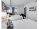 Bedroom with two beds, modern decor and a mounted television at 7100 N Ocean Blvd. # 317, Myrtle Beach, SC 29572