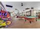Spacious game room featuring modern arcade games and billiard tables for recreation and entertainment at 7100 N Ocean Blvd. # 317, Myrtle Beach, SC 29572