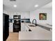 Well-lit kitchen features white cabinets and stylish backsplash at 7100 N Ocean Blvd. # 317, Myrtle Beach, SC 29572