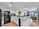 Updated kitchen with view to a bright living area and balcony at 7100 N Ocean Blvd. # 317, Myrtle Beach, SC 29572