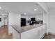 Modern kitchen with white cabinets and a sleek black refrigerator at 7100 N Ocean Blvd. # 317, Myrtle Beach, SC 29572