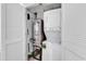Laundry area featuring a stacked washer and dryer inside of a utility closet at 7100 N Ocean Blvd. # 317, Myrtle Beach, SC 29572