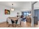 Bright open concept living and dining areas with views to the balcony at 7100 N Ocean Blvd. # 317, Myrtle Beach, SC 29572