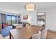 Open living area features a modern table and a view to the balcony at 7100 N Ocean Blvd. # 317, Myrtle Beach, SC 29572