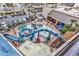 A Gathering-friendly resort waterpark with winding slides and palm trees offers a fun vacation experience at 7100 N Ocean Blvd. # 317, Myrtle Beach, SC 29572