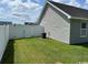 Home's fenced backyard features a well-maintained lawn, offering a private outdoor space at 753 Bucklin Loop, Myrtle Beach, SC 29579