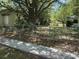 View of the backyard with grass and chain link fence at 8 Ryan Ln., Myrtle Beach, SC 29579