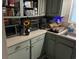 Cozy kitchen with green cabinets, laminate countertops and essential appliances at 8 Ryan Ln., Myrtle Beach, SC 29579