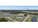 Community aerial view featuring a pond, green spaces, and residential homes near Myrtle Beach at 8077 Fort Hill Way, Myrtle Beach, SC 29579