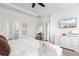 Bright bedroom with a TV, walk-in closet, and ensuite bathroom at 8077 Fort Hill Way, Myrtle Beach, SC 29579