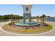 Inviting community entrance with water features, lush landscaping, and clear signage at 8077 Fort Hill Way, Myrtle Beach, SC 29579