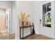 Bright foyer with a console table, decorative accents, and view of a hallway at 8077 Fort Hill Way, Myrtle Beach, SC 29579