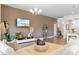Well-lit living room features trendy decor, an entertainment area, and an open floor plan at 8077 Fort Hill Way, Myrtle Beach, SC 29579
