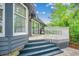 Exterior angle of back deck with grill, stairs, and side of house at 8209 Timber Ridge Rd., Conway, SC 29526