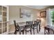 Elegant dining area with natural light, stylish decor, and a view through French doors at 8209 Timber Ridge Rd., Conway, SC 29526