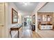 Inviting hallway with hardwood floors and stylish decor leading to a dining area at 8209 Timber Ridge Rd., Conway, SC 29526