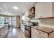 Bright eat-in kitchen with stainless appliances, granite countertops and dining table overlooking backyard at 8209 Timber Ridge Rd., Conway, SC 29526