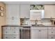 Kitchen featuring white cabinets, granite countertops, stainless steel appliances, and stylish backsplash at 8209 Timber Ridge Rd., Conway, SC 29526