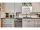 Kitchen featuring white cabinets, stainless steel appliances, granite countertops, and a hidden coffee station at 8209 Timber Ridge Rd., Conway, SC 29526