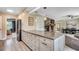 An open kitchen layout with a large island, stainless steel appliances, and easy access to living spaces at 8209 Timber Ridge Rd., Conway, SC 29526