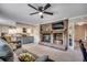 Gathering room with fireplace, TV, and kitchen view, perfect for gatherings at 8209 Timber Ridge Rd., Conway, SC 29526
