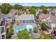 Aerial view of a community pool, surrounded by seating, and manicured landscaping at 829 9Th Ave. S, North Myrtle Beach, SC 29582
