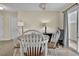 Cozy dining area features a round table with seating for four near a sliding glass door at 829 9Th Ave. S, North Myrtle Beach, SC 29582