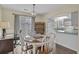 Bright dining area features a table with seating and adjacent kitchen access at 829 9Th Ave. S, North Myrtle Beach, SC 29582