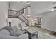 Bright living room featuring a staircase and an open view into the dining area at 829 9Th Ave. S, North Myrtle Beach, SC 29582