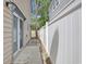 View of the side yard with a sliding glass door and a privacy fence at 829 9Th Ave. S, North Myrtle Beach, SC 29582