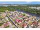 Aerial view of an upscale neighborhood with a red-roofed home highlighted at 837 Bluff View Dr., Myrtle Beach, SC 29579