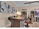 Stylish bar area with a dark wood bar, seating, and decor, ideal for entertaining guests at 837 Bluff View Dr., Myrtle Beach, SC 29579
