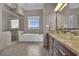 Bathroom with glass shower, tub and vanity with glass sink at 837 Bluff View Dr., Myrtle Beach, SC 29579
