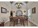 A spacious dining room features wood floors, a large chandelier, and elegant furnishings for memorable gatherings at 837 Bluff View Dr., Myrtle Beach, SC 29579