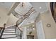 Elegant foyer featuring a winding staircase, chandelier, and stylish decor at 837 Bluff View Dr., Myrtle Beach, SC 29579