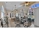 Spacious game room with a pool table, lounge area, and access to an outdoor patio and swimming pool at 837 Bluff View Dr., Myrtle Beach, SC 29579