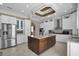 Modern kitchen with white cabinetry, granite countertops, a center island, and stainless steel appliances at 837 Bluff View Dr., Myrtle Beach, SC 29579