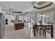 Bright kitchen featuring white cabinets, stainless appliances, a granite island, and a casual dining space at 837 Bluff View Dr., Myrtle Beach, SC 29579