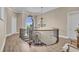 Second floor landing with iron railings overlooking the foyer below at 837 Bluff View Dr., Myrtle Beach, SC 29579