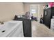 Well-equipped laundry room with a washer, dryer, and storage cabinets at 837 Bluff View Dr., Myrtle Beach, SC 29579