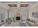 Bright living room with a tiled fireplace, comfortable seating, and access to an outdoor space at 837 Bluff View Dr., Myrtle Beach, SC 29579