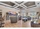 Spacious living room with coffered ceilings, hardwood floors, and natural light creates an inviting atmosphere at 837 Bluff View Dr., Myrtle Beach, SC 29579