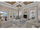 Bright living room with a tiled fireplace, comfortable seating, and access to an outdoor space at 837 Bluff View Dr., Myrtle Beach, SC 29579