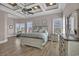 Spacious main bedroom features tray ceilings, ceiling fan, and luxury vinyl plank flooring at 837 Bluff View Dr., Myrtle Beach, SC 29579