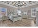Bedroom features tray ceilings, ceiling fan, and luxury vinyl plank flooring at 837 Bluff View Dr., Myrtle Beach, SC 29579